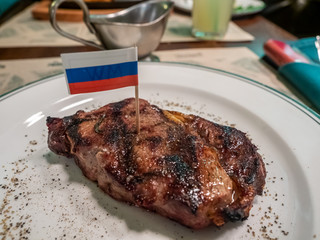 Beef steak on white dish