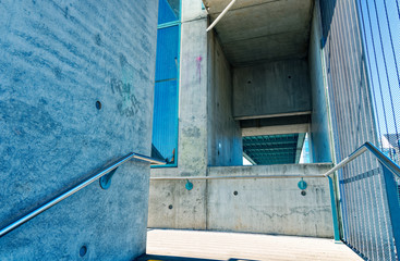Staircase in a public overpass with concrete and steel and bars