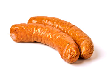 Meat sausages with glitter on a light background. Three boiled pork sausages. The concept of traditional cuisine.