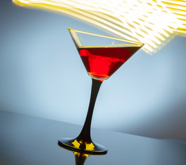 red wine in a glass on a colored background