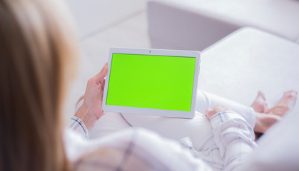 woman holding digital tablet