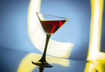 red wine in a glass on a colored background