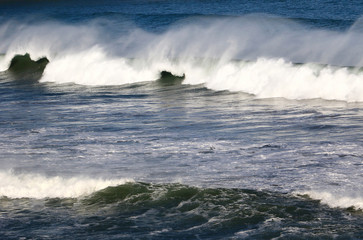 waves crashing on rocks