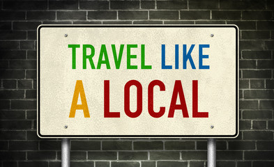 Fototapeta premium Travel like a local - road sign message