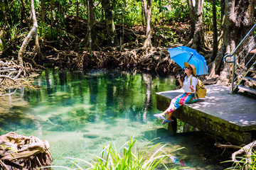 Asian women travel relax, travel nature in the holiday. women enjoying Sitting and watching the...