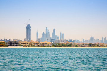 Fototapeta premium Dubai Marina skyscrapers and villas on the Palm Jumeirah. Luxury properties of UAE