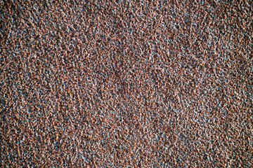 The texture of the red granite of different types. Background.