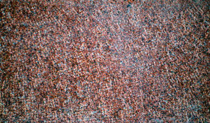 The texture of the red granite of different types. Background.