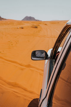  Driving On Rough Outback Gravel Red Sand Track. 4x4 Off Road Land Vehicle Taking Tourists On Desert Dune Bashing Safari. Wadi Rum Desert In Jordan Sunset