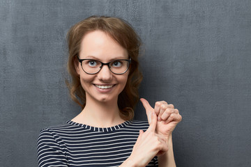 Portrait young woman making list of something with fingers