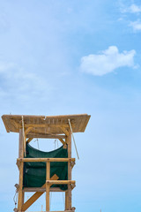                            Wooden lifeguard tower against a blue sky. Copy space.    