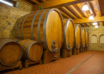 Old wooden barrels with wine