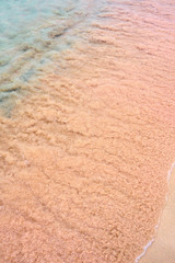 Fototapeta na wymiar Colorful sand on tropic beach. Copy space. 