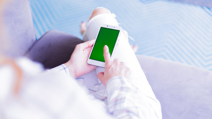 woman using digital mobile phone inthe room