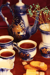 three cups of tea with teapot