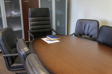 Wooden table and  leather armchairs with copy space.Rollerball Pen And Empty To Do List
