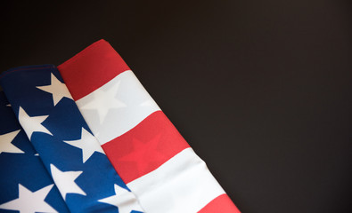 American flag close up in dark background with copy space