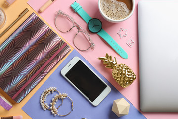 Naklejka na ściany i meble Flat lay composition with smartphone and accessories on color background. Beauty blogger