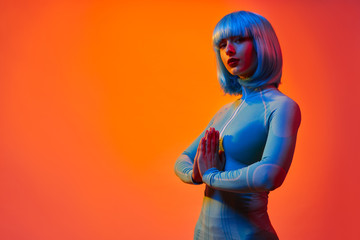 Futuristic female with clasped hands