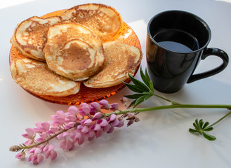 pancakes and a cup of black coffee lupin