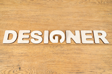 Word designer on a wooden board