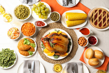 Delicious festive dinner with roasted turkey on table, flat lay