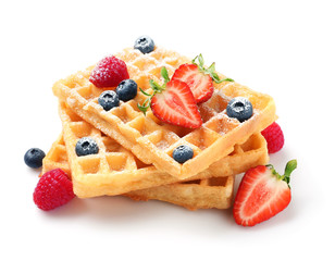 Delicious waffles with berries on white background