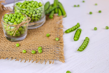 Green pea in glass, pea pods, scattered pea,on white background.