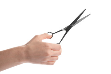 Woman holding hairdresser's scissors on white background, closeup