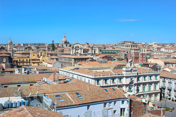 Fototapeta na wymiar Amazing view of historical city Catania, Sicily, Italy taken from above from roofs of historical buildings in the old town. The city is a popular tourist destination