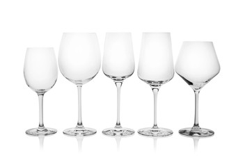 Different empty wine glasses on white background