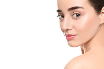 Naklejka premium Portrait of young woman with beautiful face against white background