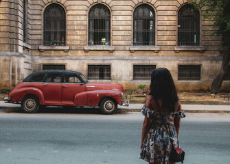 Colorful street and old car in Havana, Cuba
