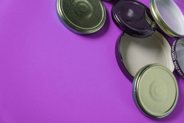 Recycling glass jar lids for reuse of single use items; Zero no waste recycle program campaigns; Recyclable concept on blank empty copyspace, text room space for copy on horizontal pink background.