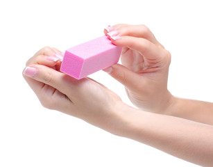 Female hand manicure nail buff on white background isolation