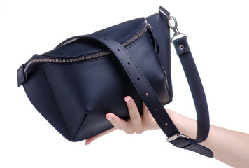 Black leather waist bag in hand on white background isolation