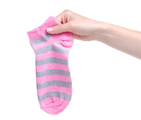 Pink socks in hand on white background isolation