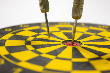dart hit on center of dartboard. business success concept.