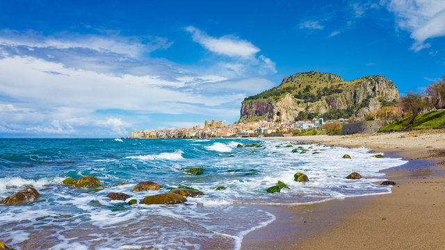 Long beach near Cefalu, town on Tyrrhenian coast of Sicily, Italy