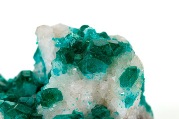 Macro mineral stone Dioptase silicate copper on a white background