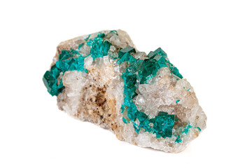 Macro mineral stone Dioptase silicate copper on a white background