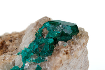 Macro mineral stone Dioptase silicate copper on a white background