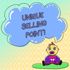 Handwriting text Unique Selling Point. Concept meaning product feature that makes it diverse from other brand Baby Sitting on Rug with Pacifier Book and Blank Color Cloud Speech Bubble