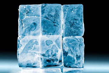 Textured frosty ice blocks isolated on black background.