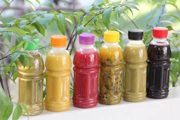 Different fruit juices in the bottle