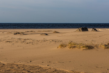 windy sea beach with white sand and blue water