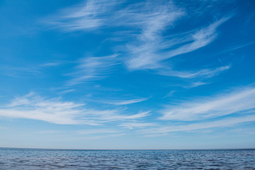 windy sea beach with white sand and blue water