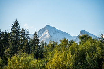 panoramic view of tatra mountains in slovakia in sunny day with blue sky © Martins Vanags