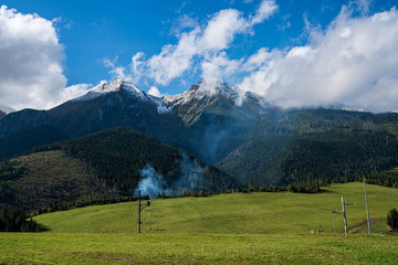 panoramic view of tatra mountains in slovakia in sunny day with blue sky © Martins Vanags