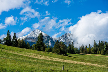 Fototapeta na wymiar panoramic view of tatra mountains in slovakia in sunny day with blue sky